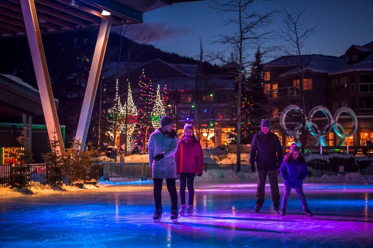 Ice skating at night at Whistler Olympic Plaza